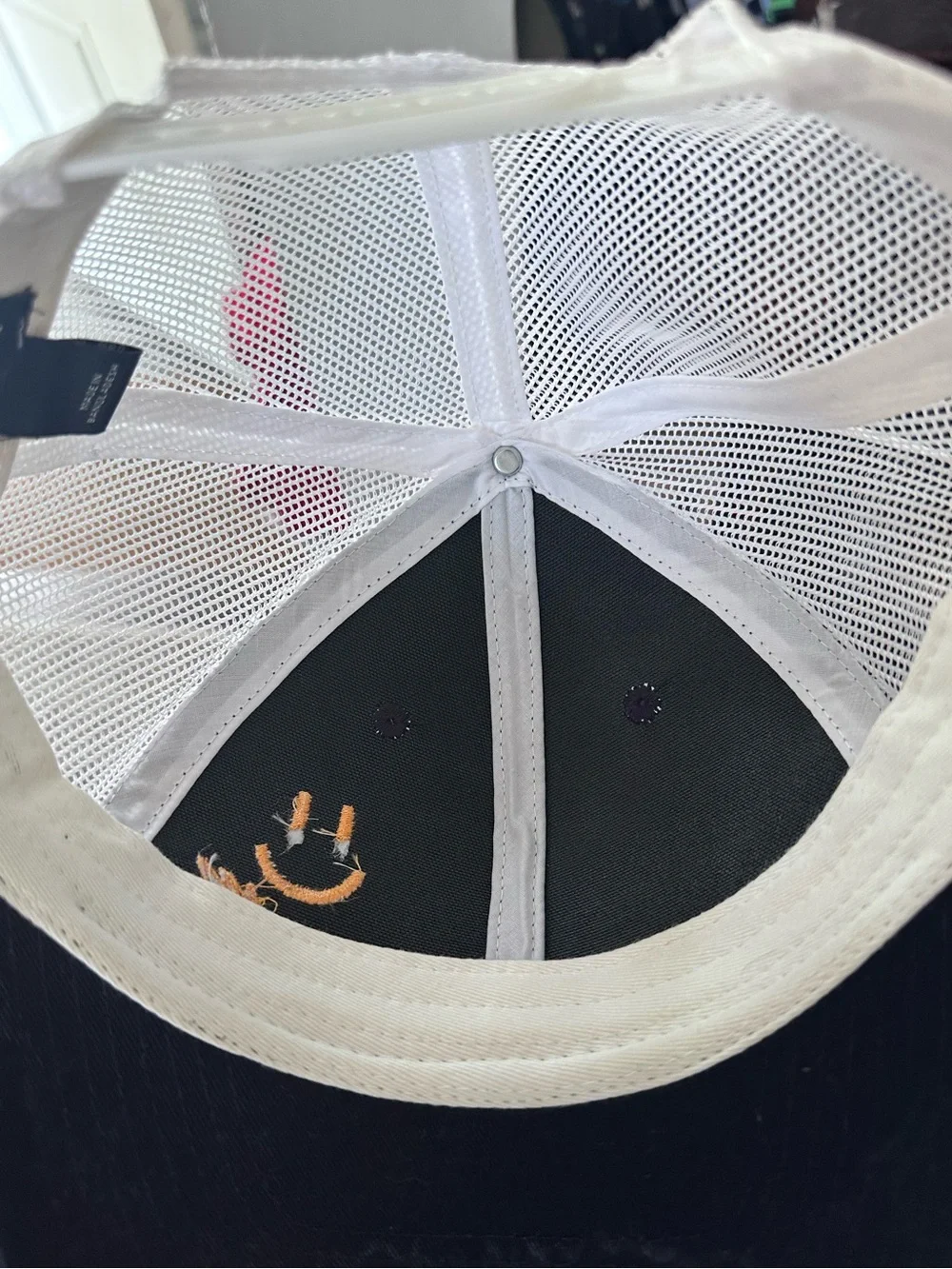 Navy and White Mesh Trucker Hat with Gold/Yellow Smiley Embroidery